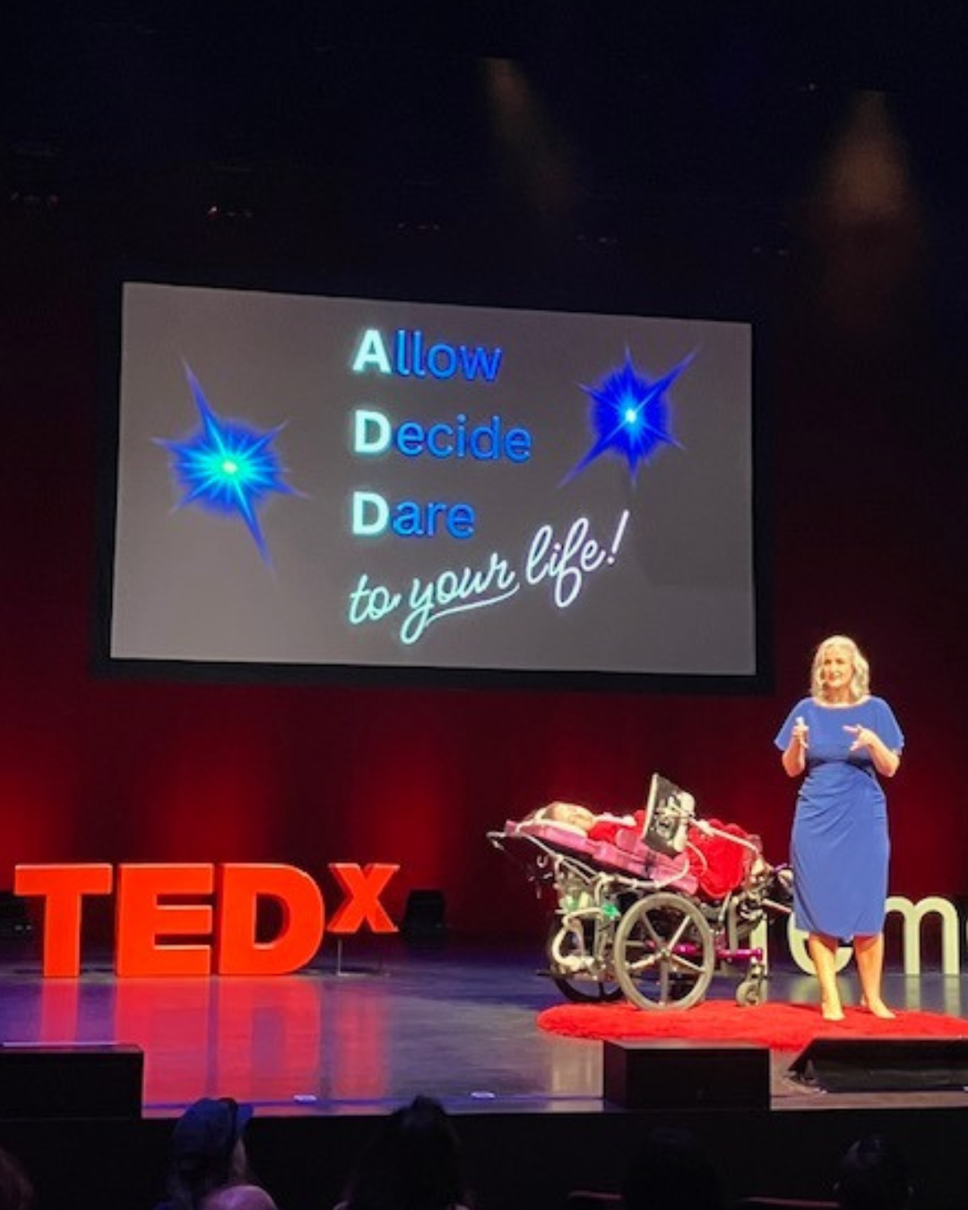 Kennedy and Jennifer on stage during their Tedx talk.